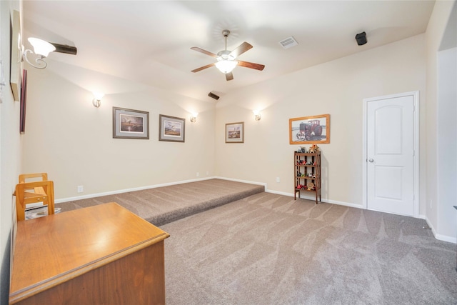 sitting room featuring ceiling fan, lofted ceiling, and carpet floors