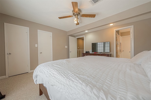 bedroom with light colored carpet and ceiling fan