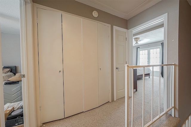 hallway with a textured ceiling