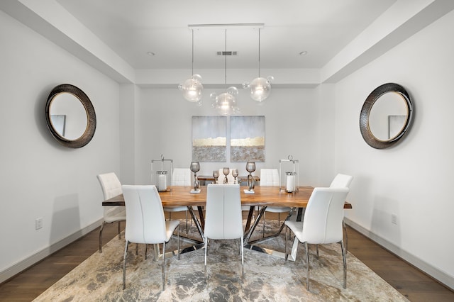 dining space with dark hardwood / wood-style flooring