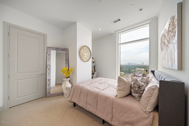 bedroom featuring light carpet