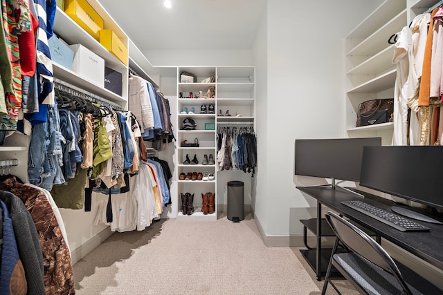 walk in closet featuring carpet floors