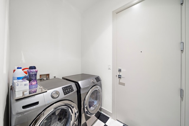 washroom featuring independent washer and dryer