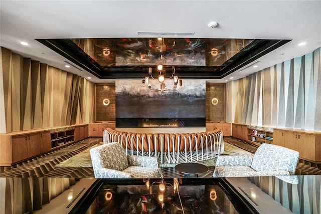 home theater room featuring a tray ceiling