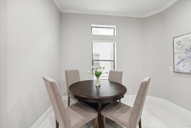 dining area featuring ornamental molding