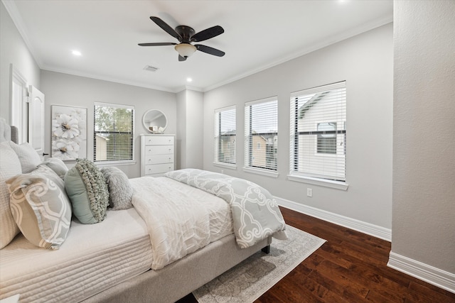 bedroom with ceiling fan, dark hardwood / wood-style floors, and crown molding