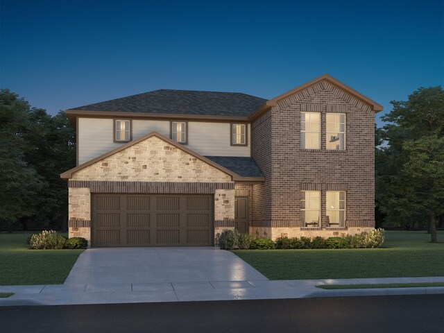 front of property with a garage and a front lawn