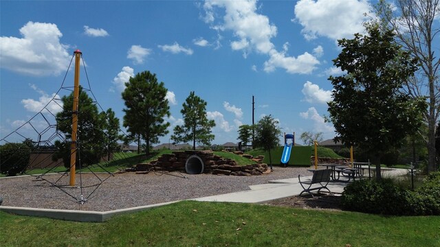 view of jungle gym featuring a lawn