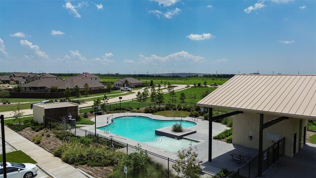 view of swimming pool featuring a patio area