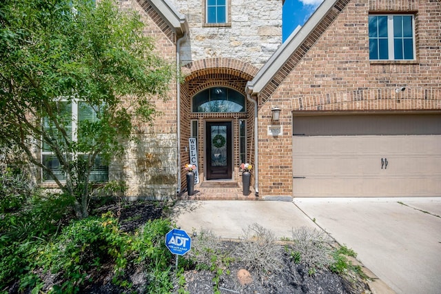 view of exterior entry featuring a garage