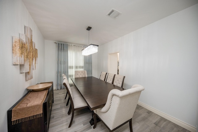 dining space featuring light hardwood / wood-style floors