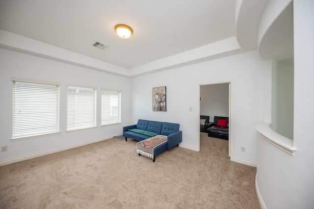 living area featuring light colored carpet