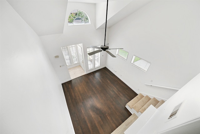 entrance foyer with high vaulted ceiling, ceiling fan, and dark hardwood / wood-style floors