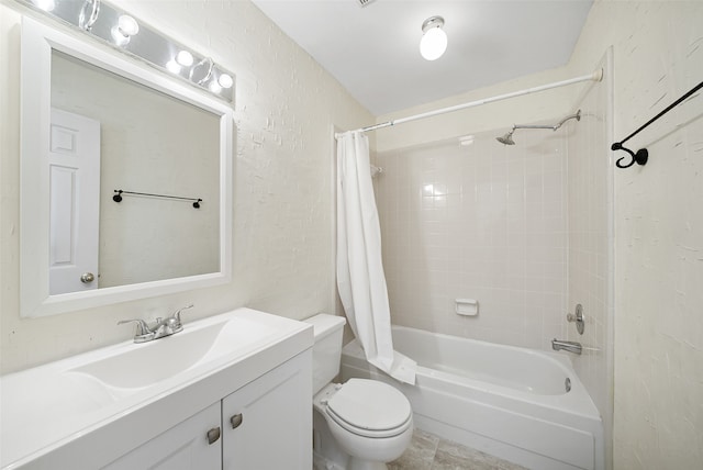 full bathroom featuring vanity, shower / bath combo with shower curtain, and toilet