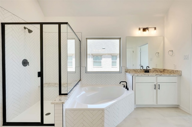 bathroom featuring separate shower and tub, tile patterned floors, and vanity