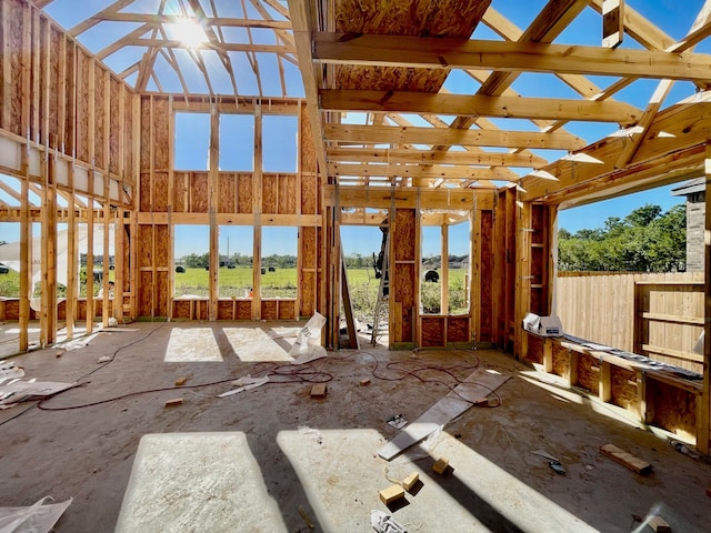 misc room featuring a wealth of natural light and a high ceiling