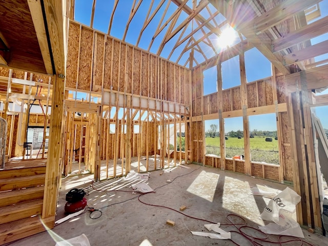 misc room with a rural view and a high ceiling