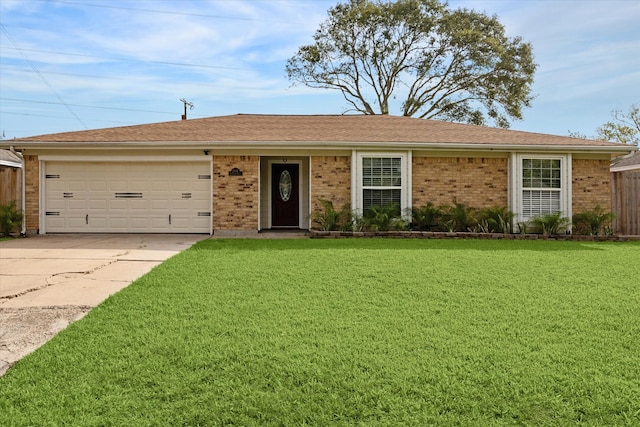 single story home with a garage and a front yard