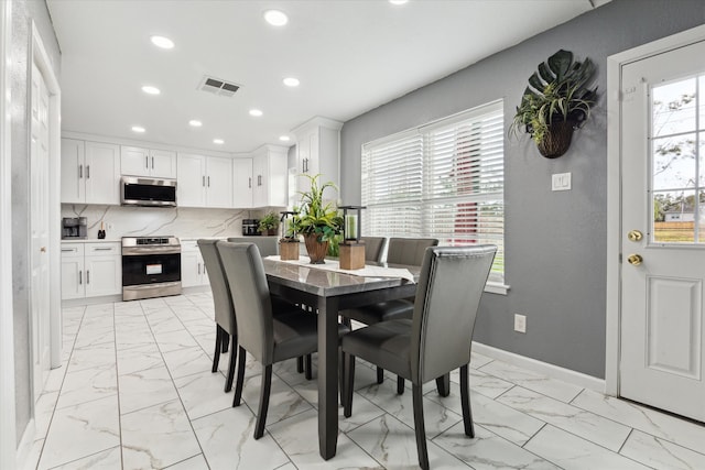 dining space featuring plenty of natural light