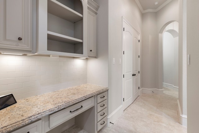 interior space with crown molding