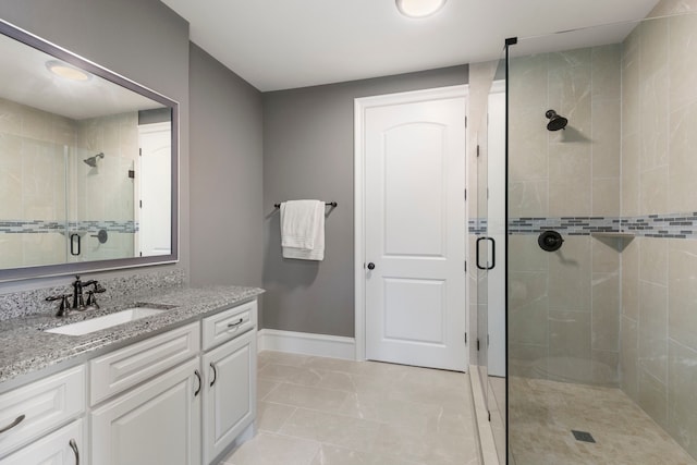 bathroom with vanity and an enclosed shower