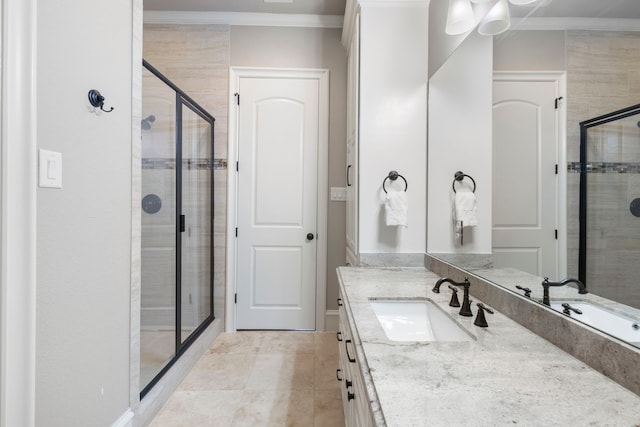 bathroom with tile patterned floors, vanity, crown molding, and walk in shower