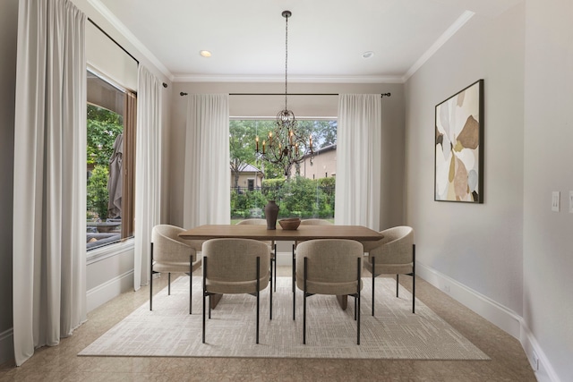 dining area with a notable chandelier and crown molding