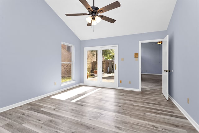 unfurnished room featuring high vaulted ceiling, light wood-type flooring, and ceiling fan