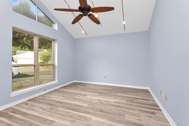 unfurnished room featuring high vaulted ceiling, light wood-type flooring, and ceiling fan