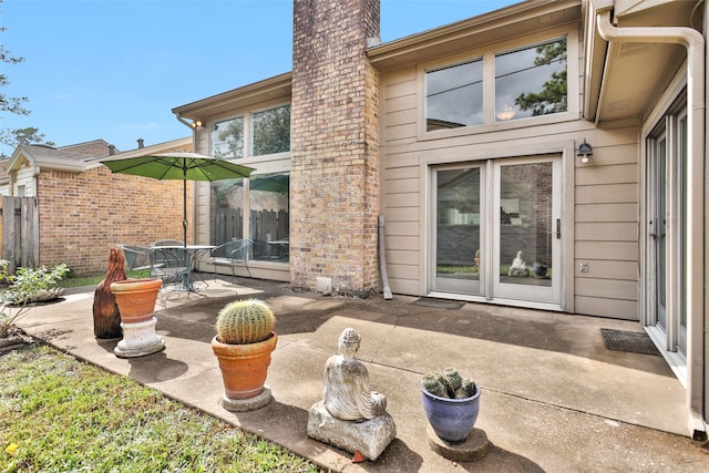 back of property with a patio