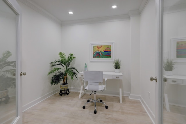 office featuring ornamental molding and light hardwood / wood-style flooring