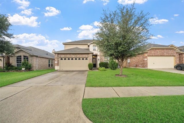 view of front of property featuring a front lawn and a garage