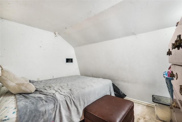 carpeted bedroom featuring vaulted ceiling