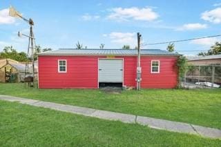 view of outbuilding featuring a yard