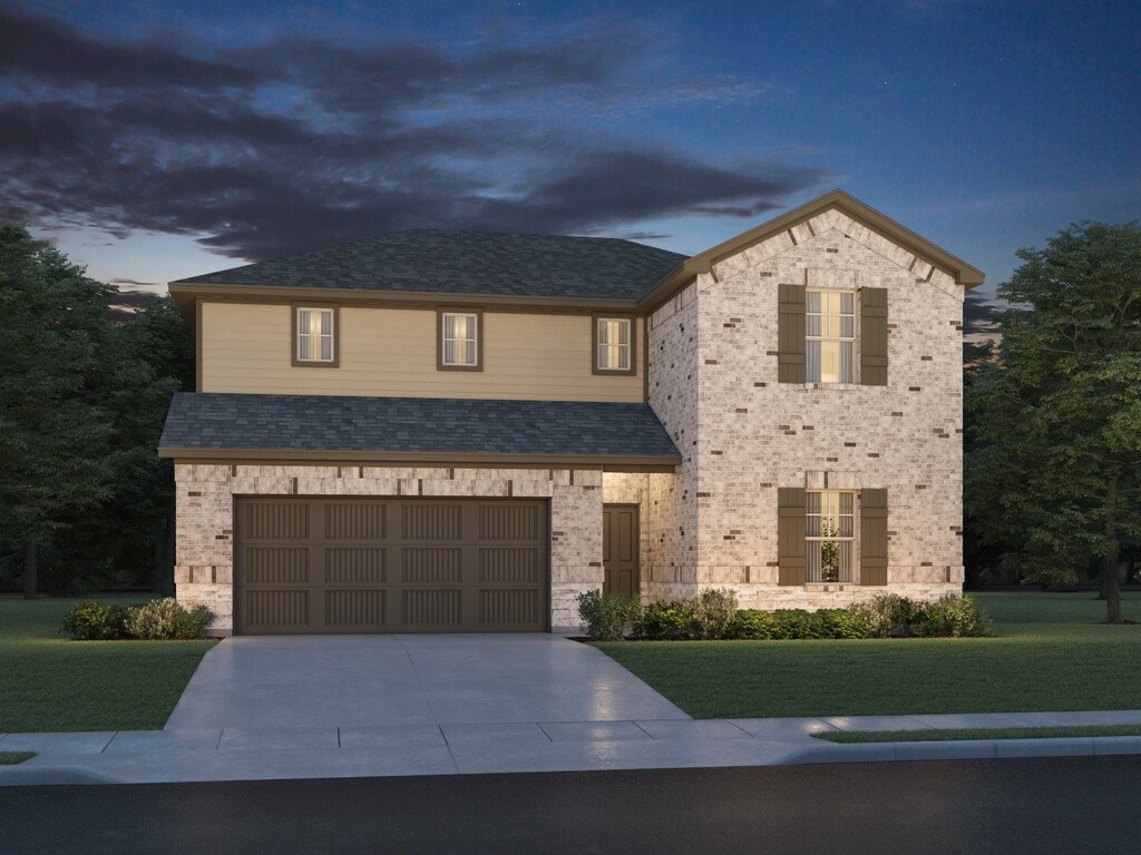 2526 Bay Winds Ln, Baytown, TX 77523 - view of front of house with a front lawn, concrete driveway, an attached garage, and brick siding