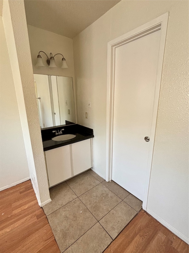 bathroom featuring wood-type flooring and vanity