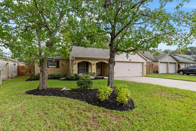 single story home with a front yard and a garage