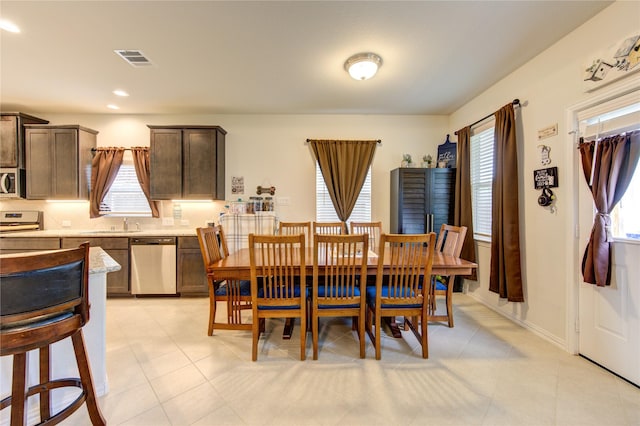 8438 Sunset Isles Dr, Baytown, TX 77521 - dining room with healthy amount of natural light and recessed lighting