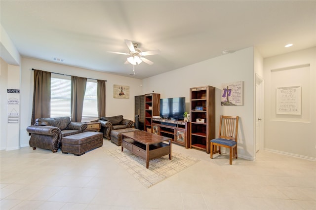 8438 Sunset Isles Dr, Baytown, TX 77521 - living area featuring a ceiling fan, baseboards, and light tile patterned flooring