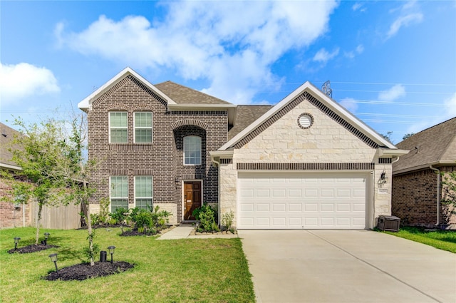8438 Sunset Isles Dr, Baytown, TX 77521 - view of front of home with concrete driveway, an attached garage, a front lawn, brick siding, and stone siding