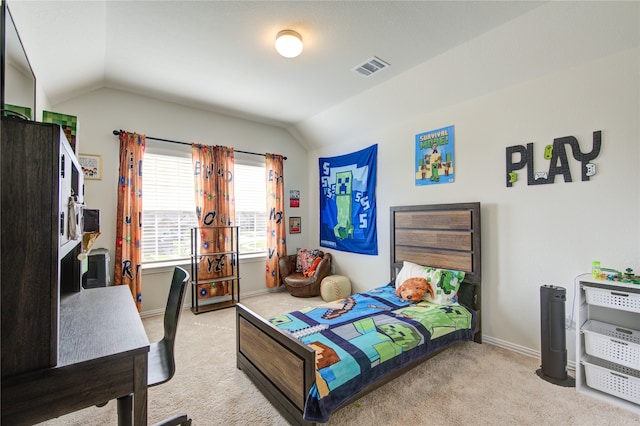 carpeted bedroom featuring lofted ceiling