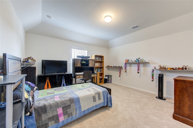 carpeted bedroom featuring lofted ceiling