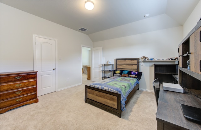 carpeted bedroom with vaulted ceiling