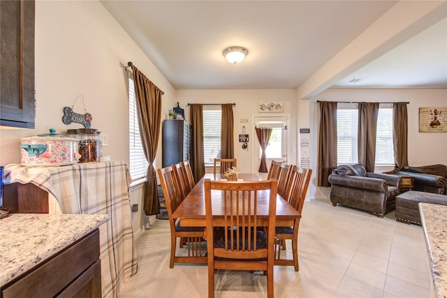 8438 Sunset Isles Dr, Baytown, TX 77521 - dining room featuring light tile patterned floors and baseboards