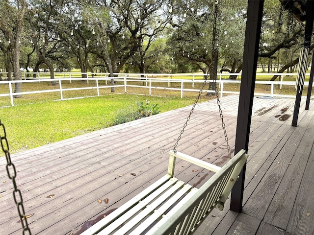 wooden deck featuring a yard