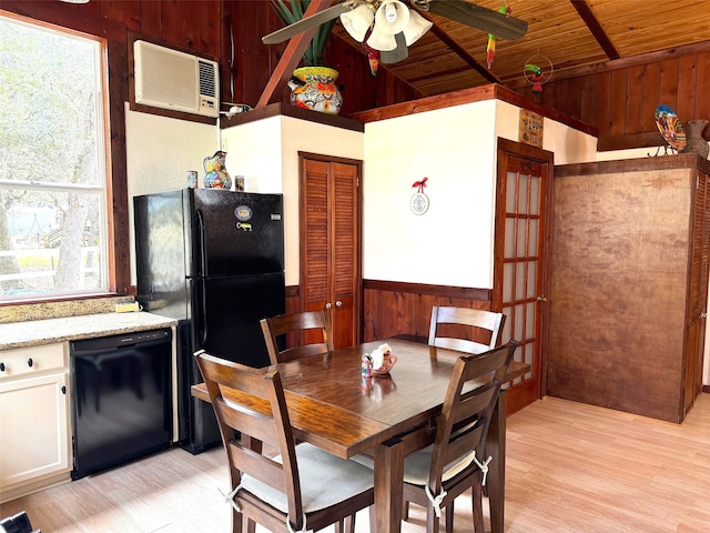 dining area featuring wood walls, light hardwood / wood-style floors, a wall unit AC, wooden ceiling, and ceiling fan