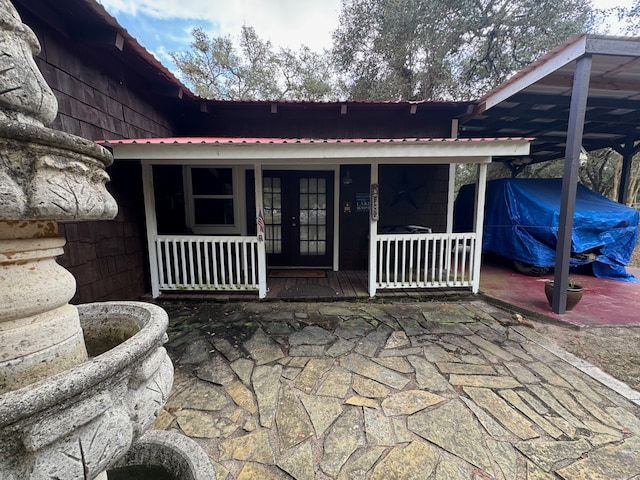 doorway to property featuring a porch