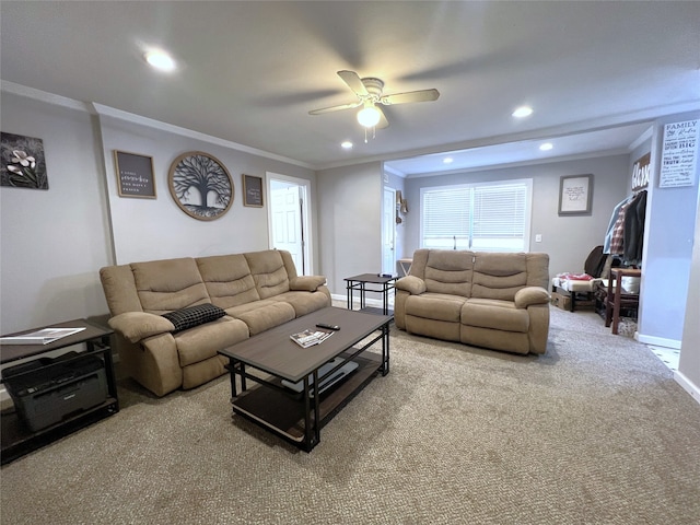 carpeted living room featuring crown molding and ceiling fan