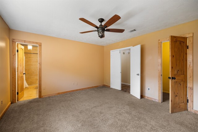 unfurnished bedroom featuring ceiling fan, connected bathroom, and carpet flooring