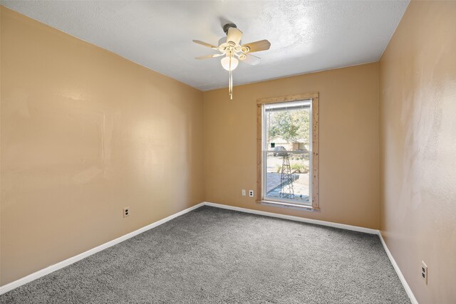 unfurnished room featuring ceiling fan, a textured ceiling, and carpet flooring